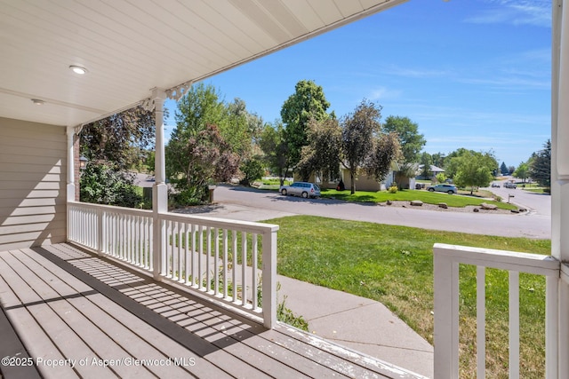1020 Alta Vista Dr, Craig, CO 81625 - wooden porch featuring a lawn