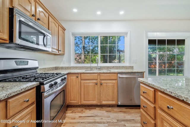 1020 Alta Vista Dr, Craig, CO 81625 - kitchen featuring stainless steel appliances, light wood finished floors, light stone counters, and recessed lighting