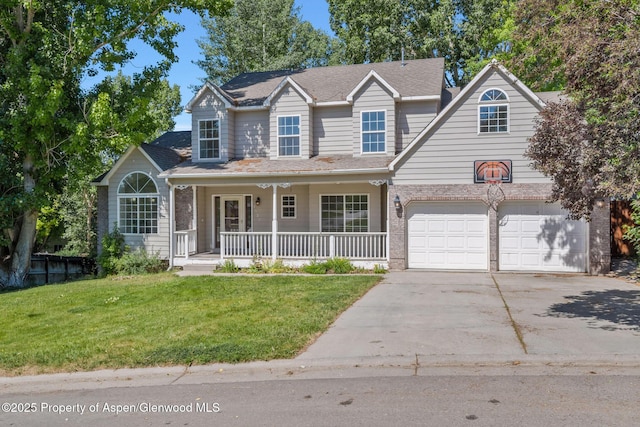1020 Alta Vista Dr, Craig, CO 81625 - traditional-style house featuring a porch, concrete driveway, a front lawn, and an attached garage