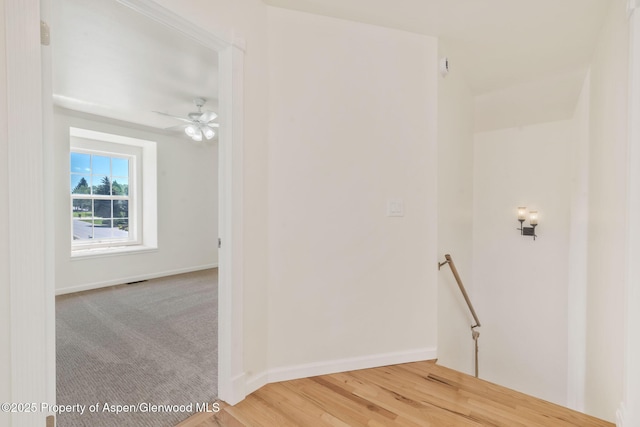 1020 Alta Vista Dr, Craig, CO 81625 - corridor featuring an upstairs landing and wood finished floors
