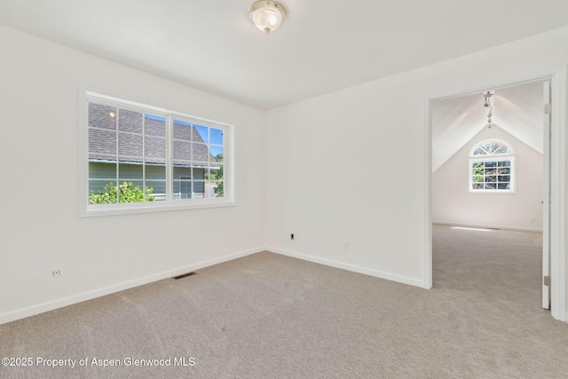 1020 Alta Vista Dr, Craig, CO 81625 - empty room featuring light carpet and lofted ceiling