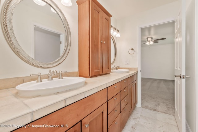 1020 Alta Vista Dr, Craig, CO 81625 - full bathroom with double vanity, marble look tiles, and a ceiling fan