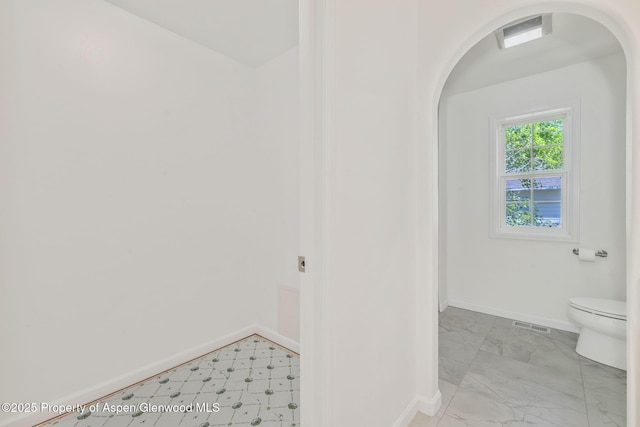 1020 Alta Vista Dr, Craig, CO 81625 - bathroom with toilet and marble look tiles