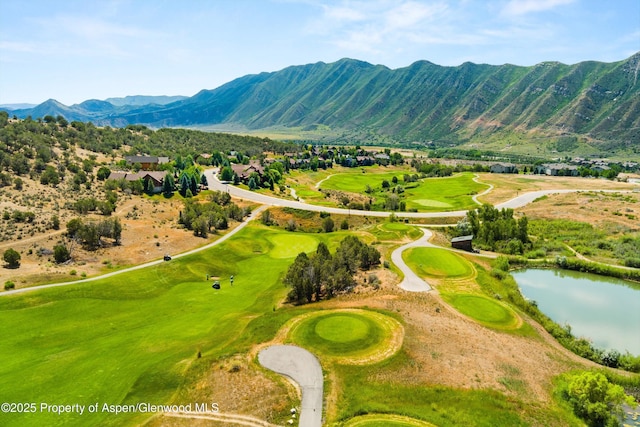 bird's eye view featuring a water and mountain view and view of golf course