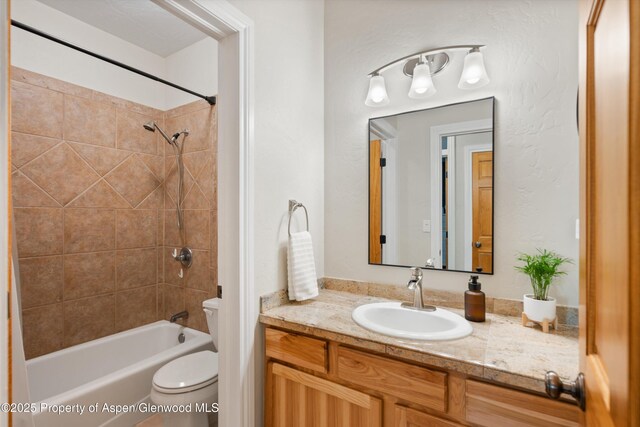 full bathroom with toilet, shower / bath combination, and vanity