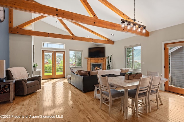 152 Blackhawk Dr, New Castle, CO 81647 - dining room with beam ceiling, recessed lighting, a tile fireplace, high vaulted ceiling, and light wood-type flooring