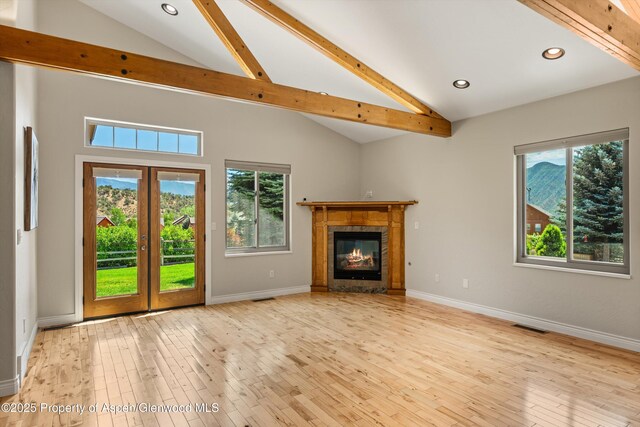 152 Blackhawk Dr, New Castle, CO 81647 - unfurnished living room featuring hardwood / wood-style flooring, beamed ceiling, a tile fireplace, recessed lighting, and high vaulted ceiling