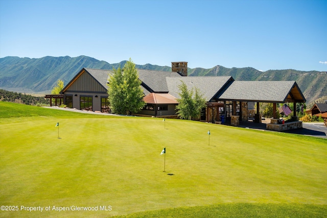 152 Blackhawk Dr, New Castle, CO 81647 - view of community featuring a putting area and a mountain view