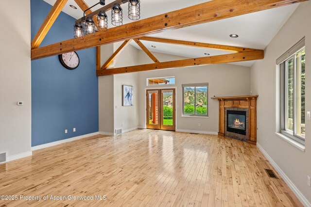 152 Blackhawk Dr, New Castle, CO 81647 - unfurnished living room with light wood-style flooring and a glass covered fireplace