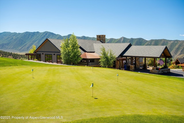 view of home's community featuring a gazebo, a mountain view, and a yard