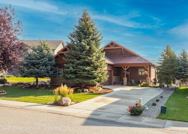 152 Blackhawk Dr, New Castle, CO 81647 - view of front facade with a front lawn, driveway, and an attached garage
