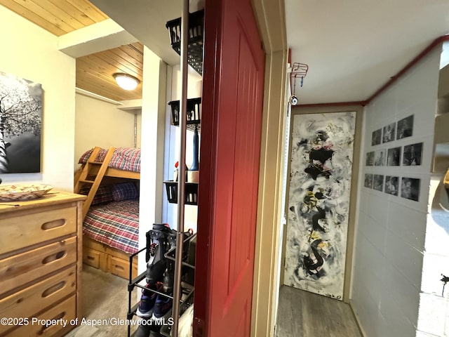 interior space featuring wooden ceiling and wood finished floors