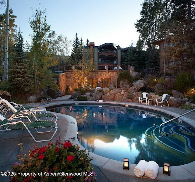 outdoor pool featuring a patio area