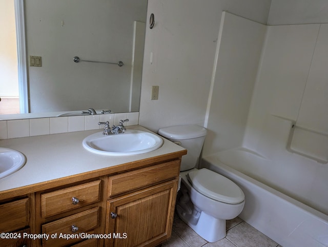 full bathroom with tile patterned floors, vanity, shower / bath combination, and toilet