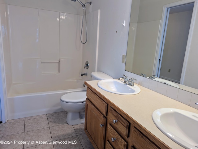 full bathroom featuring tile patterned flooring, vanity, toilet, and shower / washtub combination