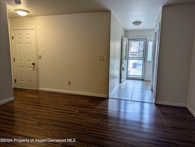 entryway with dark hardwood / wood-style floors