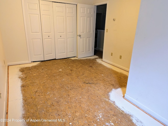 unfurnished bedroom with a closet