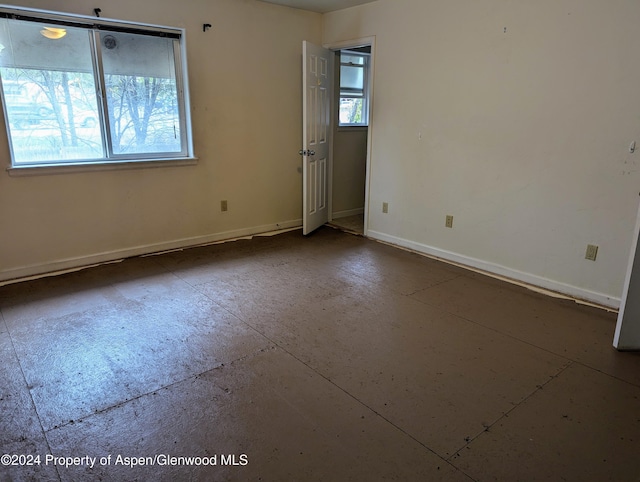 unfurnished room featuring a wealth of natural light