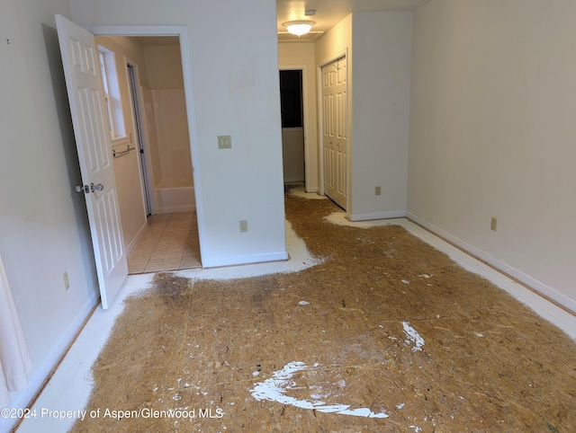 unfurnished bedroom with a closet