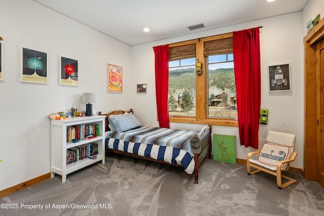 carpeted bedroom featuring baseboards, visible vents, and recessed lighting