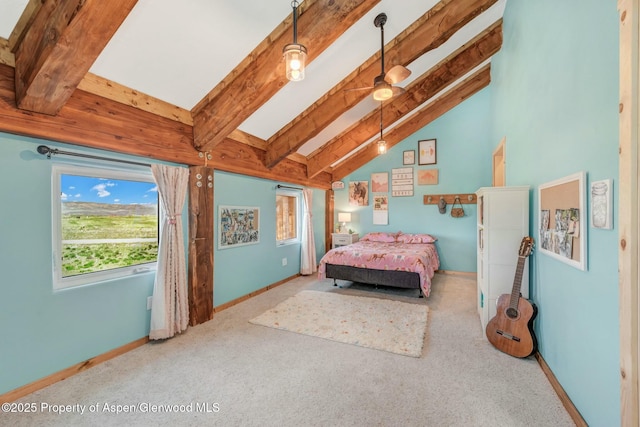 bedroom with lofted ceiling with beams, light colored carpet, and baseboards