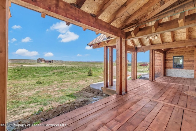 wooden terrace with a rural view