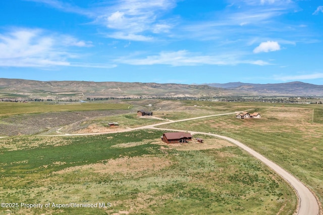 aerial view with a mountain view and a rural view