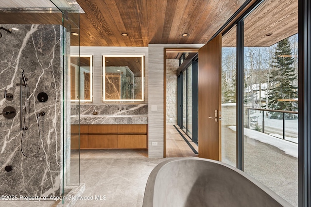 entryway with wooden ceiling and floor to ceiling windows