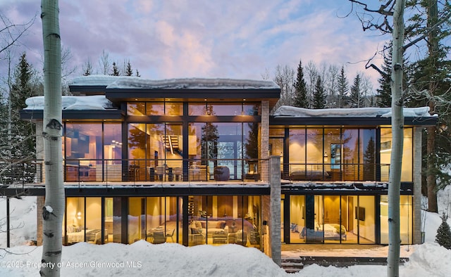 view of snow covered house