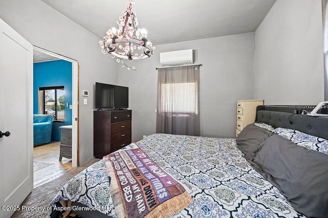 480 Minter Ave, De Beque, CO 81630 - bedroom with a wall mounted air conditioner and a chandelier