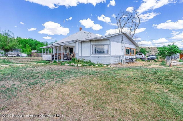 480 Minter Ave, De Beque, CO 81630 - view of front of property featuring a patio area and a chimney