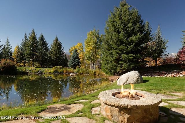 120 Running Mare Rd, Woody Creek, CO 81656 - view of yard with an outdoor fire pit and a water view