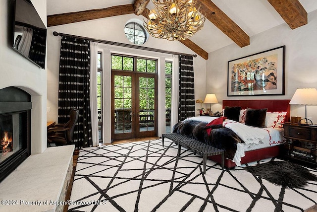 120 Running Mare Rd, Woody Creek, CO 81656 - bedroom featuring a chandelier, a glass covered fireplace, and access to outside
