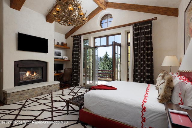 120 Running Mare Rd, Woody Creek, CO 81656 - bedroom with a chandelier, a glass covered fireplace, high vaulted ceiling, and beam ceiling