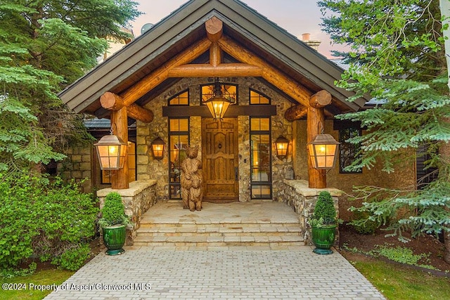 120 Running Mare Rd, Woody Creek, CO 81656 - doorway to property with stone siding and covered porch