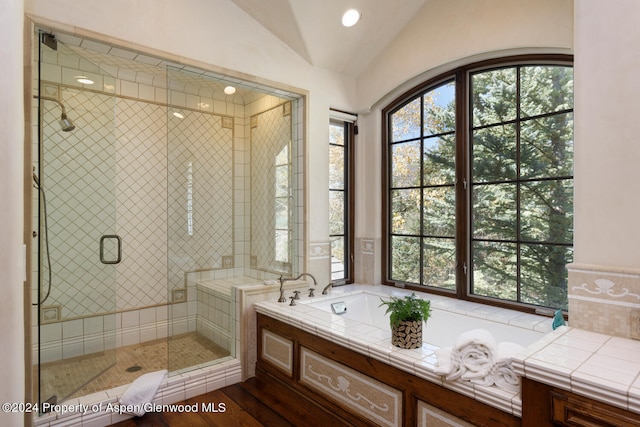 120 Running Mare Rd, Woody Creek, CO 81656 - bathroom featuring a bath, vaulted ceiling, a shower stall, recessed lighting, and wood finished floors