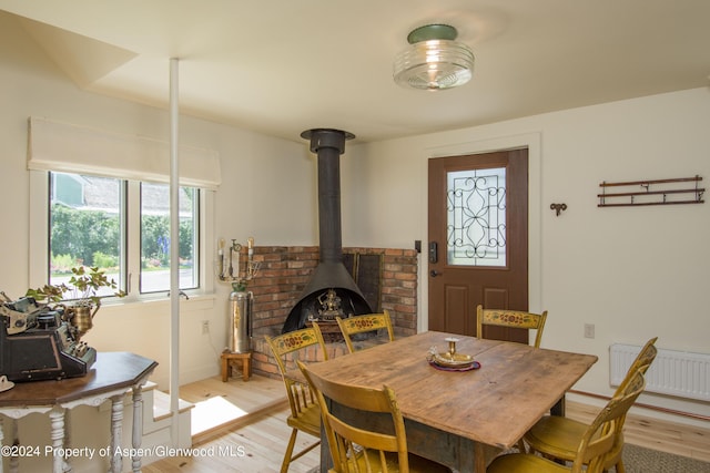 500 W Francis St, Aspen, CO 81611 - dining area featuring a wood stove and light wood-style flooring