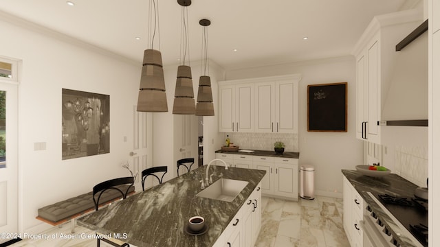 500 W Francis St, Aspen, CO 81611 - kitchen with a kitchen island with sink, marble finish floor, a sink, and white cabinetry