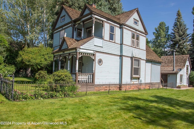500 W Francis St, Aspen, CO 81611 - view of home's exterior with fence private yard, a chimney, and a yard