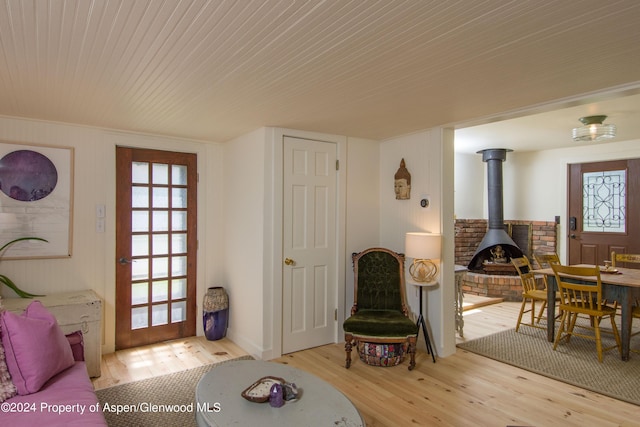 500 W Francis St, Aspen, CO 81611 - living area with a wood stove and wood finished floors