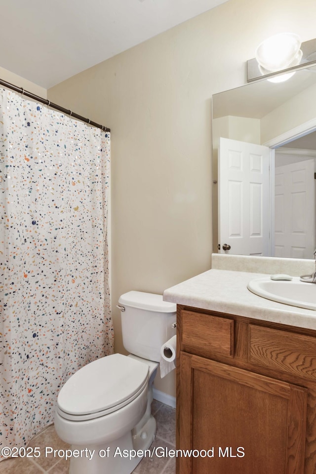 2433 Pine Ln, Rifle, CO 81650 - bathroom with vanity, tile patterned floors, and a shower with curtain