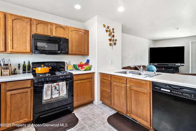 2433 Pine Ln, Rifle, CO 81650 - kitchen with black appliances, light countertops, open floor plan, and recessed lighting