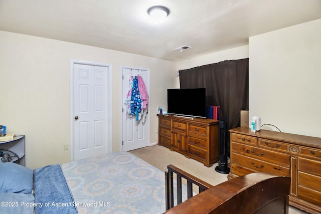 2433 Pine Ln, Rifle, CO 81650 - bedroom featuring light carpet and a closet