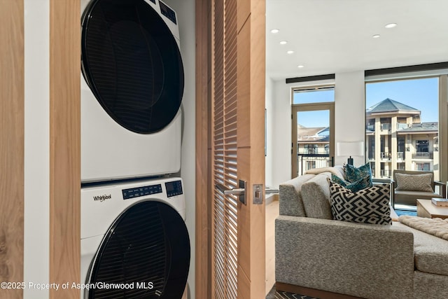 laundry room with stacked washer and dryer