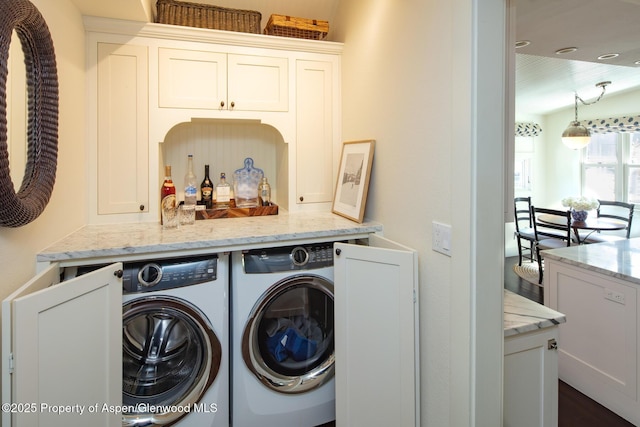222 W Hopkins Ave Unit 5, Aspen, CO 81611 - laundry area featuring washing machine and dryer, cabinet space, and a dry bar