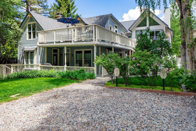 222 W Hopkins Ave Unit 5, Aspen, CO 81611 - rear view of property featuring roof with shingles, a yard, and a chimney