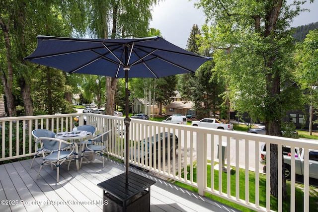 222 W Hopkins Ave Unit 5, Aspen, CO 81611 - wooden terrace featuring outdoor dining area