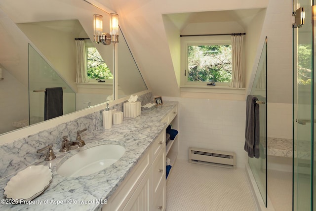 222 W Hopkins Ave Unit 5, Aspen, CO 81611 - full bathroom featuring a baseboard radiator, vanity, a chandelier, a stall shower, and wainscoting