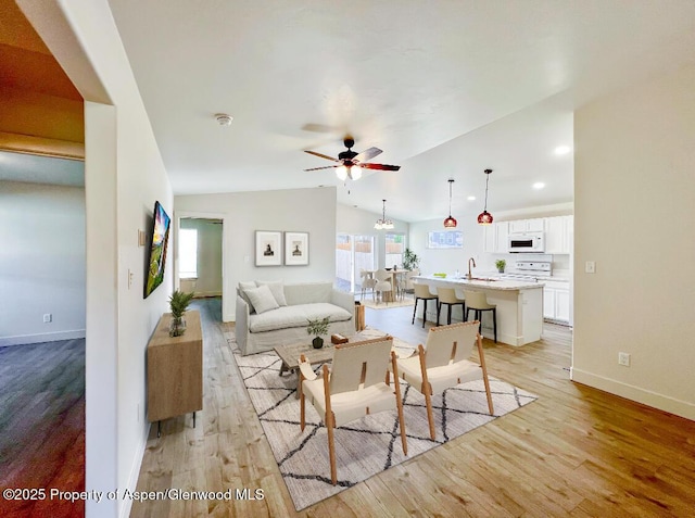 1652 E 17th Cir, Rifle, CO 81650 - living area with light wood finished floors, ceiling fan, lofted ceiling, and recessed lighting