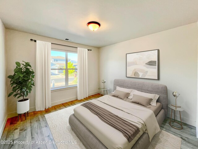 1652 E 17th Cir, Rifle, CO 81650 - bedroom with wood finished floors and baseboards